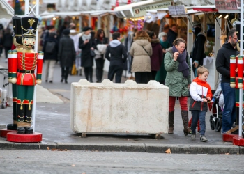 FRANCE, Paris: A concrete block is seen at one of the entries of the Champs Elysees Christmas market in Paris on December 24, 2016 after security measures were increased following the Berlin attack. - Michel STOUPAK