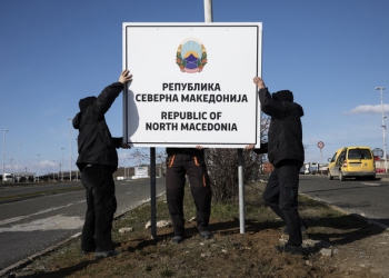 Workers erect a new road sign reading "Republic of North Macedonia" at the Greece-Macedonia Bogorodica border crossing near Gevgelija, Republic of North Macedonia, on Wednesday, February 13, 2019. A former Yugoslav republic thats been blocked from joining NATO and the European Union because of a dispute over its name has started using a new moniker thats the result of a deal to open the doors to western integration. Photographer: Konstantinos Tsakalidis/Bloomberg via Getty Images