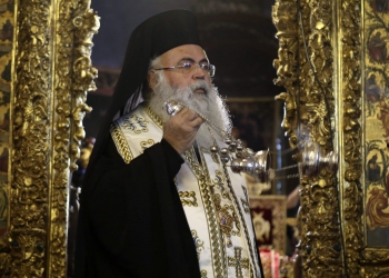 The new elected Cyprus' Orthodox Archbishop Georgios attends a mass at Saint Ioannis church at archbishopric in capital Nicosia, Cyprus, Saturday, Dec. 24, 2022. Cyprus' Orthodox Church has elected Paphos Bishop Georgios as its new leader. The 73-year-old cleric on Saturday received nine votes from the 16-member Holy Synod, the church's highest decision making body, against four for runner-up Limassol Bishop Athanasios. (AP Photo/Philippos Christou)