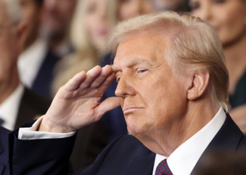 President Donald Trump salutes during the 60th Presidential Inauguration in the Rotunda of the U.S. Capitol in Washington, Monday, Jan. 20, 2025. (Kevin Lamarque/Pool Photo via AP)